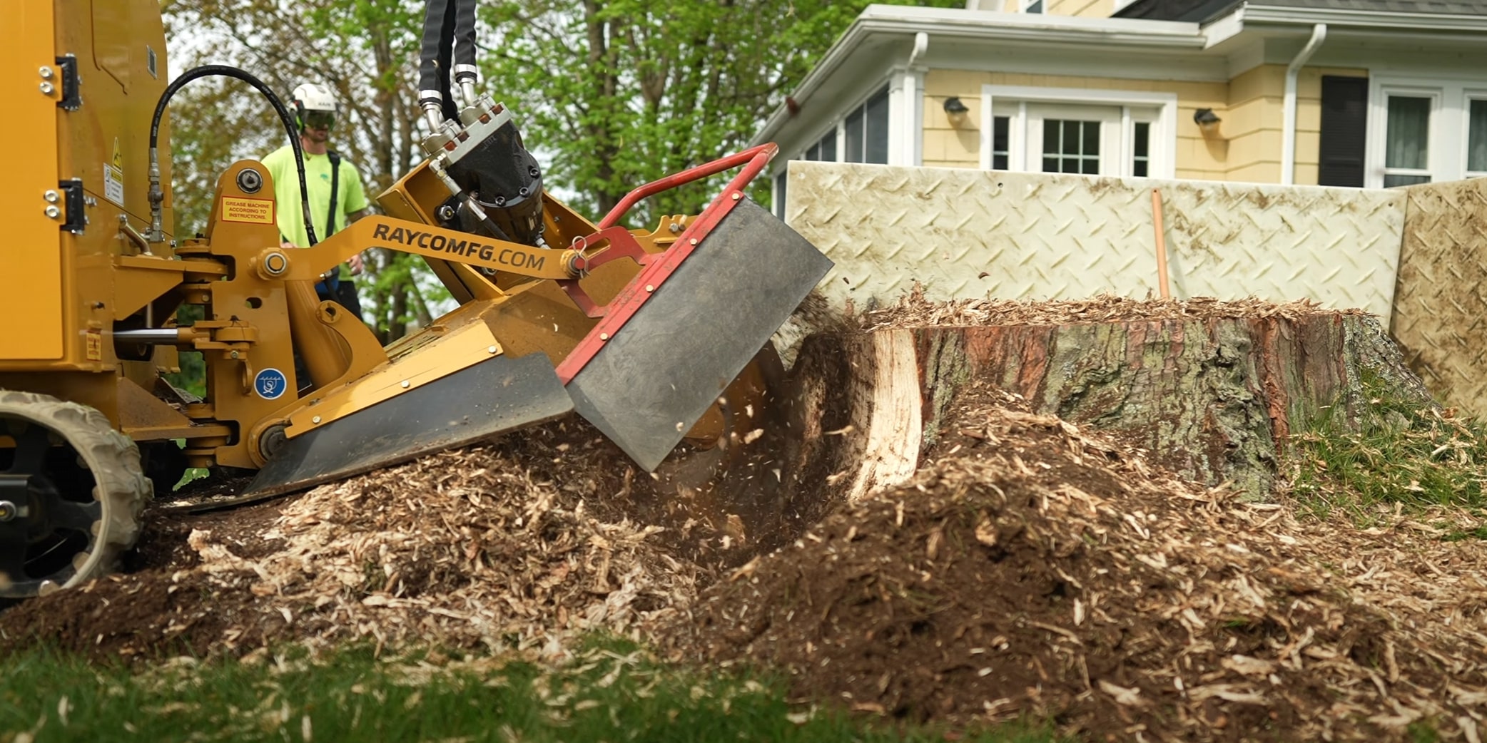 Stump grinding equipment removing tree stump in Diamond Bar backyard